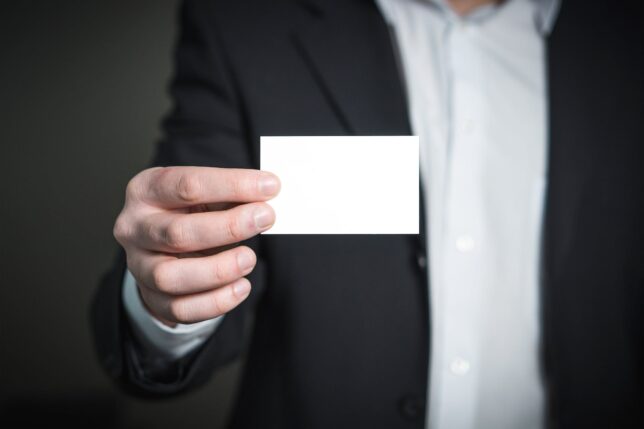 person holding white paper